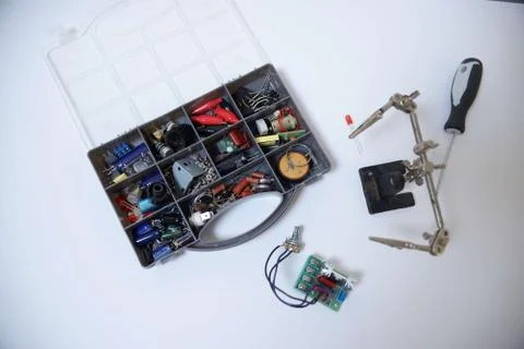 Various broken electronics parts set prepared for processing. Isolated on whi Stock Photos