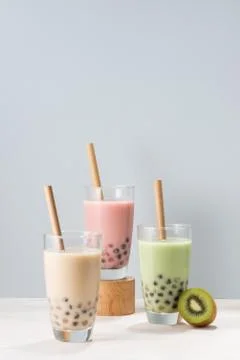Various Bubble Tea glasses with drink straws isolated on white background. Stock Photos