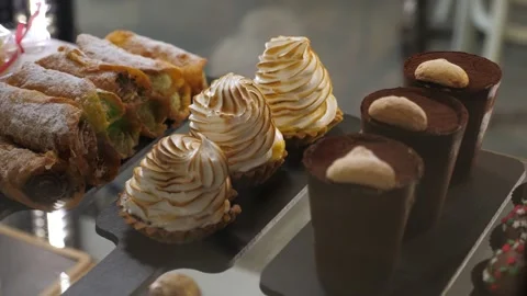 Various cakes on the counter in a modern cafe or pastry shop. Stock Footage 307392888