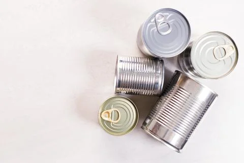 Various canned vegetables on kitchen table background. Foto stock