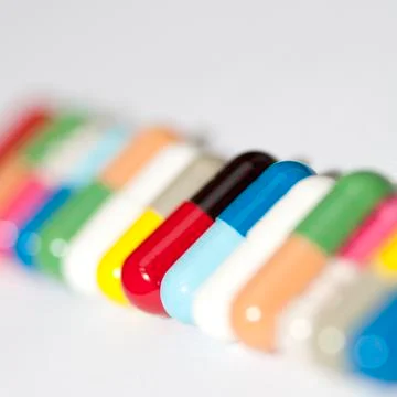 Various capsules in row Stock Photos