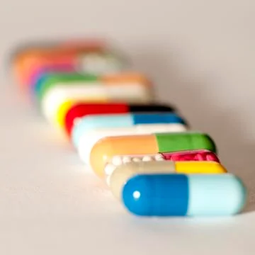 Various capsules in row Stock Photos