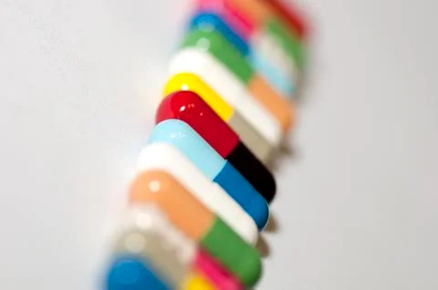 Various capsules in row Stock Photos