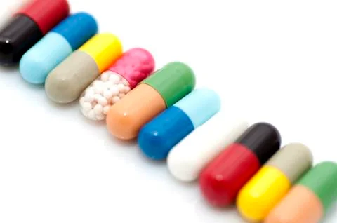 Various capsules in row Stock Photos