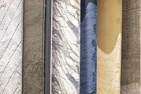 Various carpet samples with textures and patterns Stock Photos