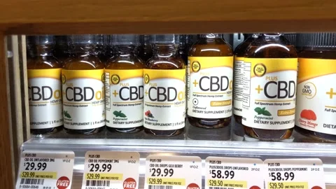Various +CBD Oil Containers Available for Purchase Stock Footage 137495951