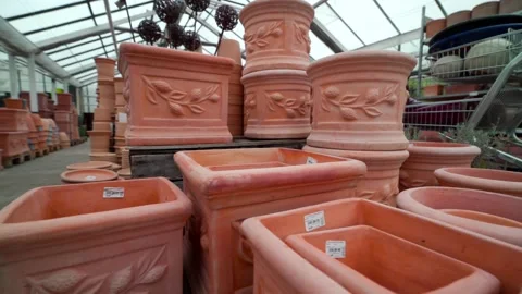 Various ceramic terra cotta pots in a DIY store. Stock Footage 213506226