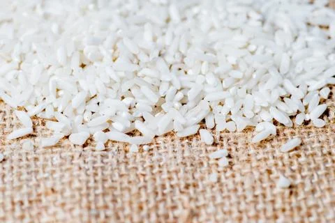 Various cereals and groats on a table Stock Photos