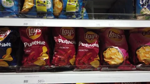 Various chips and snacks on the shelf in the store Video stock 151986134