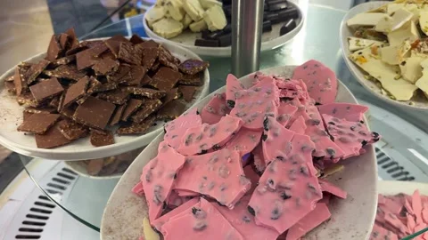 Various chocolates displayed on the shelves, assorted premium chocolate pieces Stock Footage 287804672