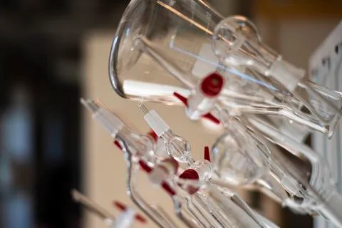 Various clean glssware hanging on the wall in a biotechnology laboratory for  Stock Photos
