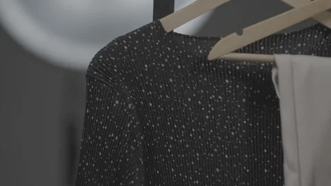 Various clothes hanging in the dressing room 29 Stock-Footage 336690681