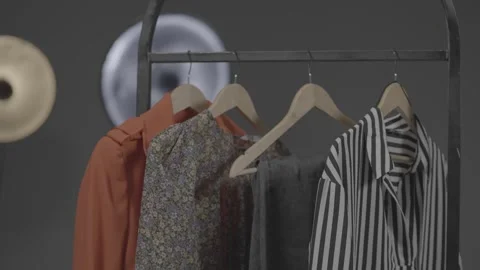 Various clothes hanging in the dressing room 35 Видео 336690746