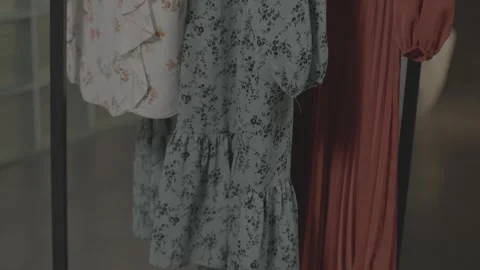 Various clothes hanging in the dressing room 43 Video stock 336690800