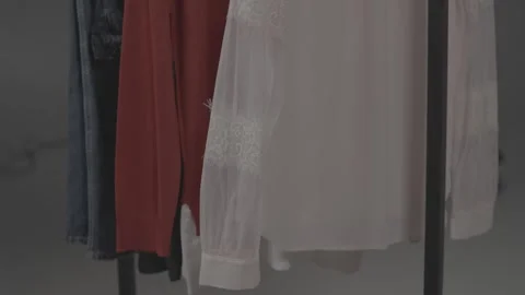 Various clothes hanging in the dressing room 45 Stock-Footage 336690815