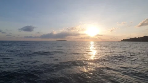 Various cloud shapes in the sky near sunrise Stock Footage 336644129