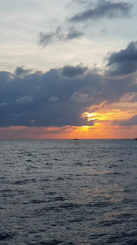 Various cloud shapes in the sky near sunrise Stock Footage 336644570