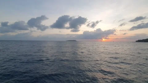 Various cloud shapes in the sky near sunrise Stock Footage 336644611