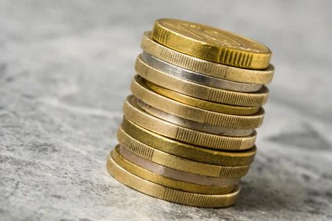 Various coins in a vertical column Stock Photos