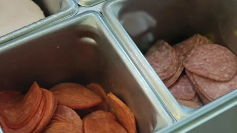 Various cold cuts in metal containers at sandwich shop Vidéo 310301805