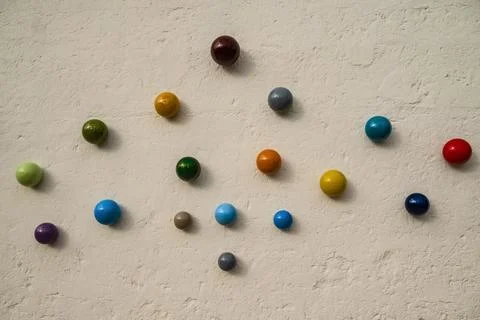 Various colored ceramic marbles displayed on a wall at Grottaglie, Italy Stock Photos