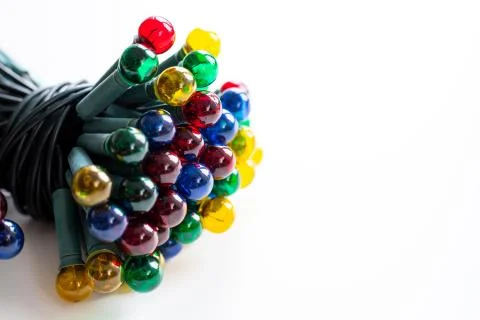 Various colored Christmas lights for a Christmas tree on a white background Stock Photos