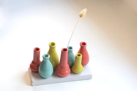 Various colored clay containers Stock Photos