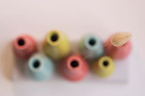 Various colored clay containers Stock Photos