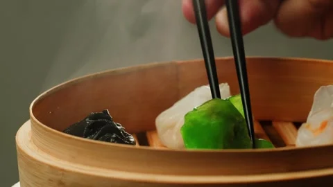 Various of colored dim sum on steamer pan close-up macro. Steaming Technique Stock Footage 256683954