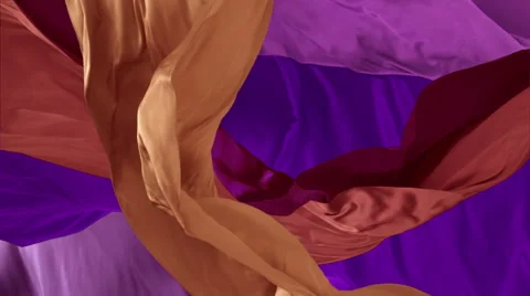 Various colored fabrics flying in midair, Slow Motion Stock Footage 42094466