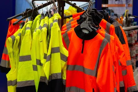 Various colored worker signal jackets. Stock Photos