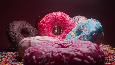 Various colorful donuts. Pile of different delicious donuts. Bakery concept Video stock 243512352