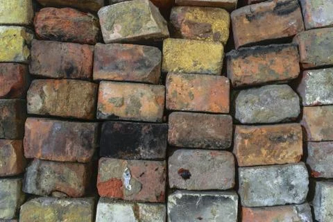 Various Colors Old Bricks Placed One on Each Other Background Surface Stock Photos