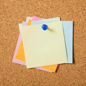 Various colors sticky post notes with pushpin cork board Stock Photos