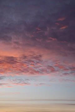 Various colors of the sunset. Fluffy clouds. Romantic sky. Stock Photos