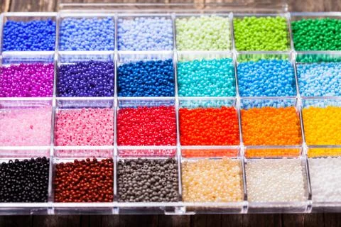 Various colour beads close up in the box Stock Photos