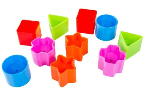 Various coloured blocks for shape sorter toy isolated Stock Photos