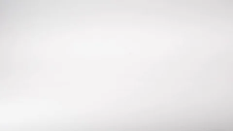 Various coloured paperclips fall in slow motion Stock Footage 117349408