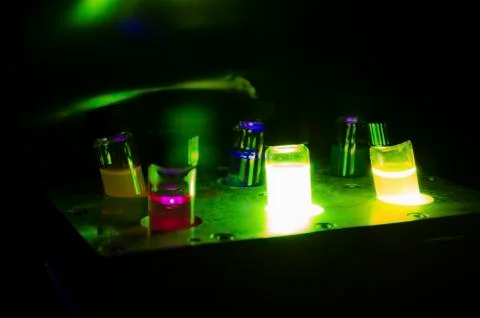 Various colourful light induced catalyst photochemical reaction in glass vial Stock Photos