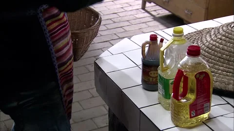 Various condiments for cooking are placed on the stove Stock Footage 252483788