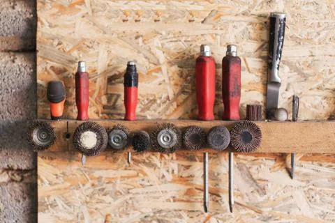 Various construction tools are hanging on the osb board Stock Photos