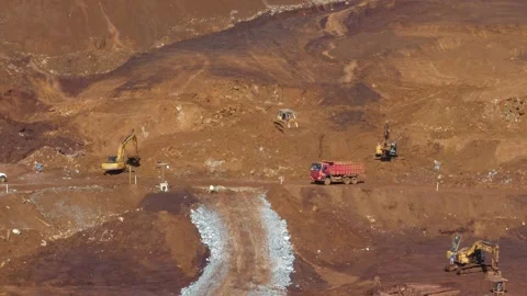 Various construction vehicles and trucks are busy at the construction site Stock Footage 132080467