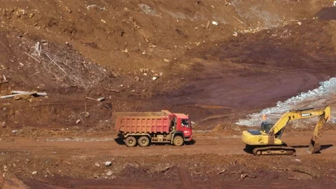 Various construction vehicles and trucks are busy at the construction site Stock Footage 132080526