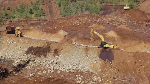 Various construction vehicles and trucks are busy at the construction site Stock Footage 132080538