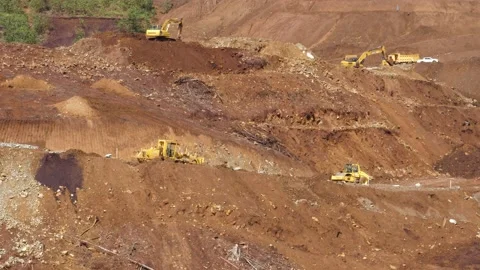 Various construction vehicles and trucks are busy at the construction site Stock Footage 132080564