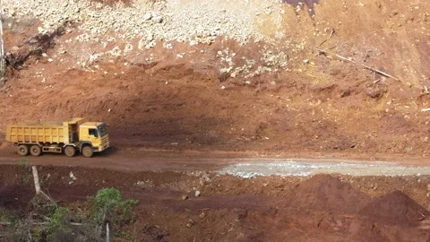 Various construction vehicles and trucks are busy at the construction site Stock Footage 132080628