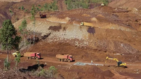 Various construction vehicles and trucks are busy at the construction site Stock Footage 132080846