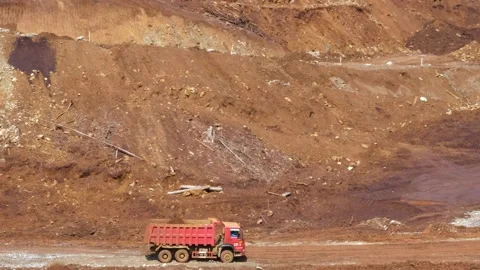 Various construction vehicles and trucks are busy at the construction site 스톡 동영상 132081034