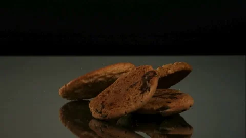 Various cookies falling and piling on a table Stock Footage 326749647