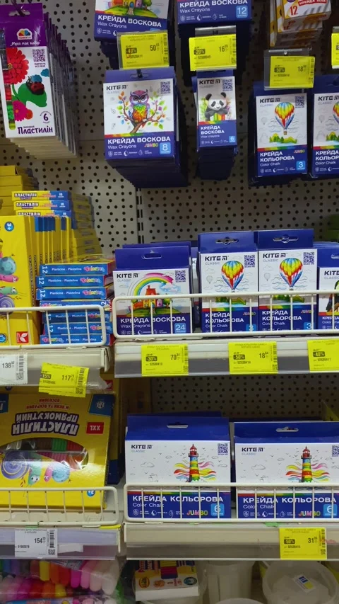 Various crayons and chalk products from kite brand stocked on shelves for sale. Stock Footage 340452933